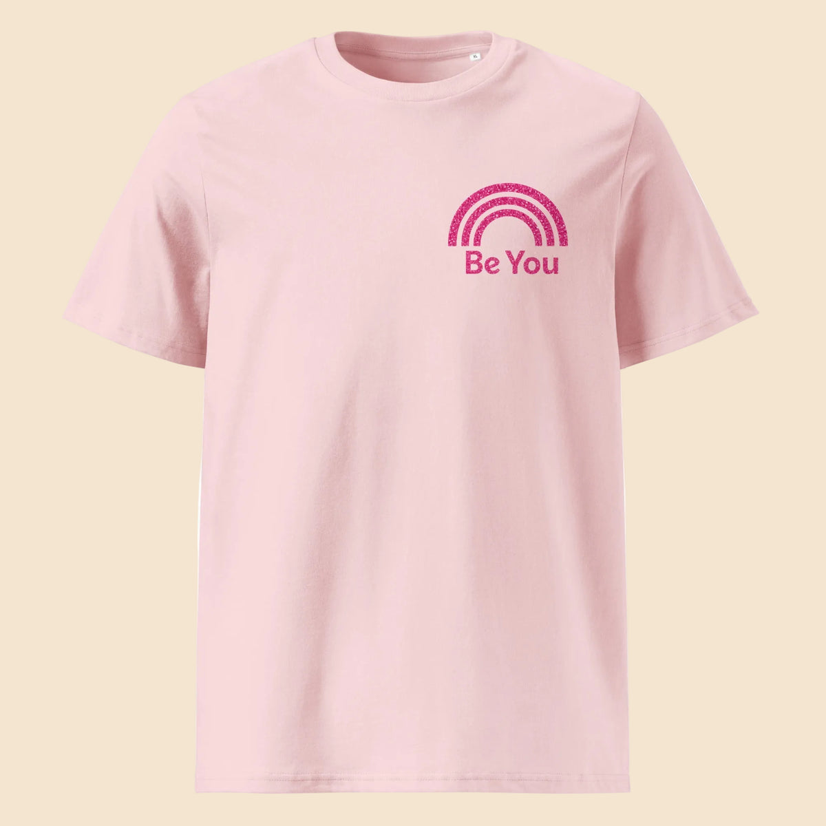 Camiseta rosa pastel de algodón orgánico con diseño minimalista de arcoíris y texto Be You Melian Vintage